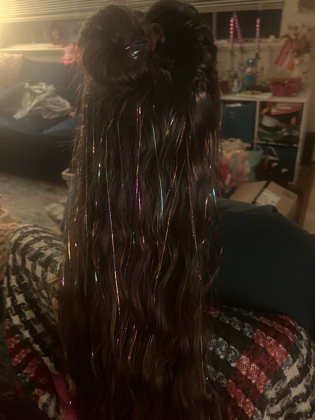 Long dark hair threaded with iridescent sparkles